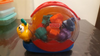 Fisher Price glazbeni puž-didaktička igračka