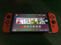 Nintendo Switch OLED + igre