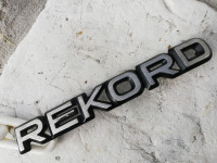 OPEL EMBLEM ZNAK, CRNI POZADINA SREBRNA.