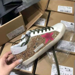 Golden Goose Super-Star gold glitter with fluorescent pink suede star