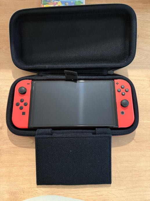 Nintendo Switch OLED + igre