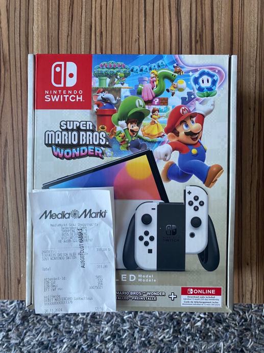 Nintendo Switch OLED Super Mario Wonder+12 mj NSO, NOVO