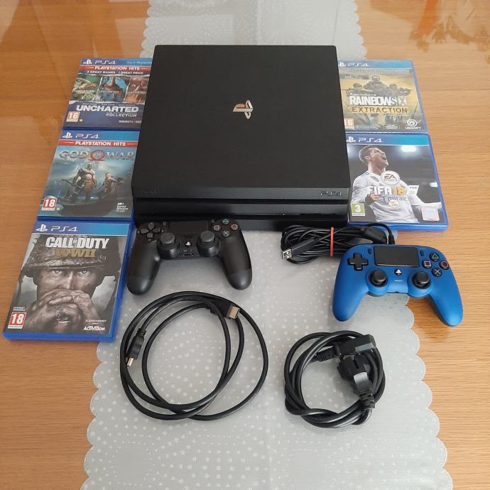 PS4 PRO 1TB + 2 kontrolera + 8 igrica